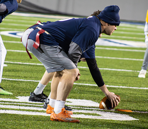 Students playing intramural flag football